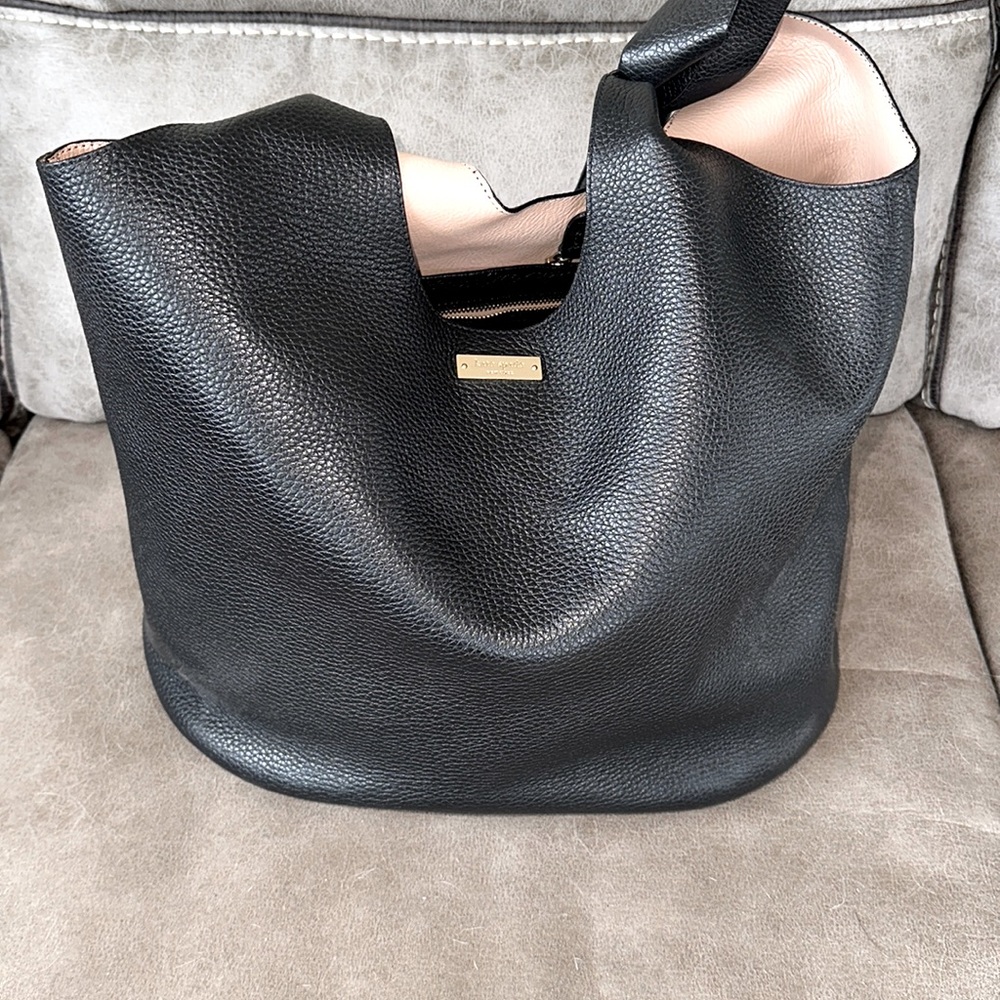 Black leather tote with pink inside